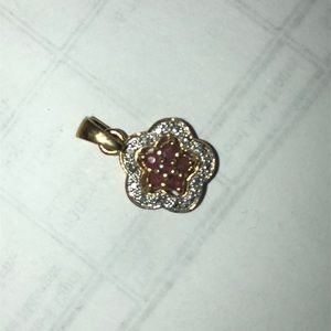 Gold plated 925 stamped ruby heart flower.